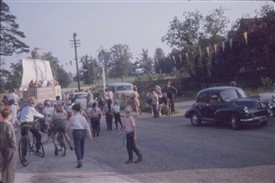 Photo:Bunting and a donkey outside the pub as the crowd follows the carnival in 1963