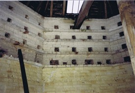 Photo:The dovecote interior in February 1988, note the lower nests have been bricked up