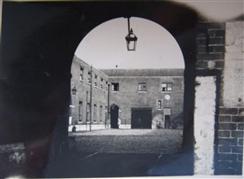 Photo:The stables at Hothfield Place viewed through the main arch